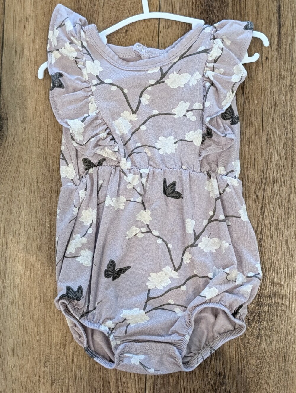 Kyte BABY Light Mauve Floral Ruffle One-Piece Bodysuit
